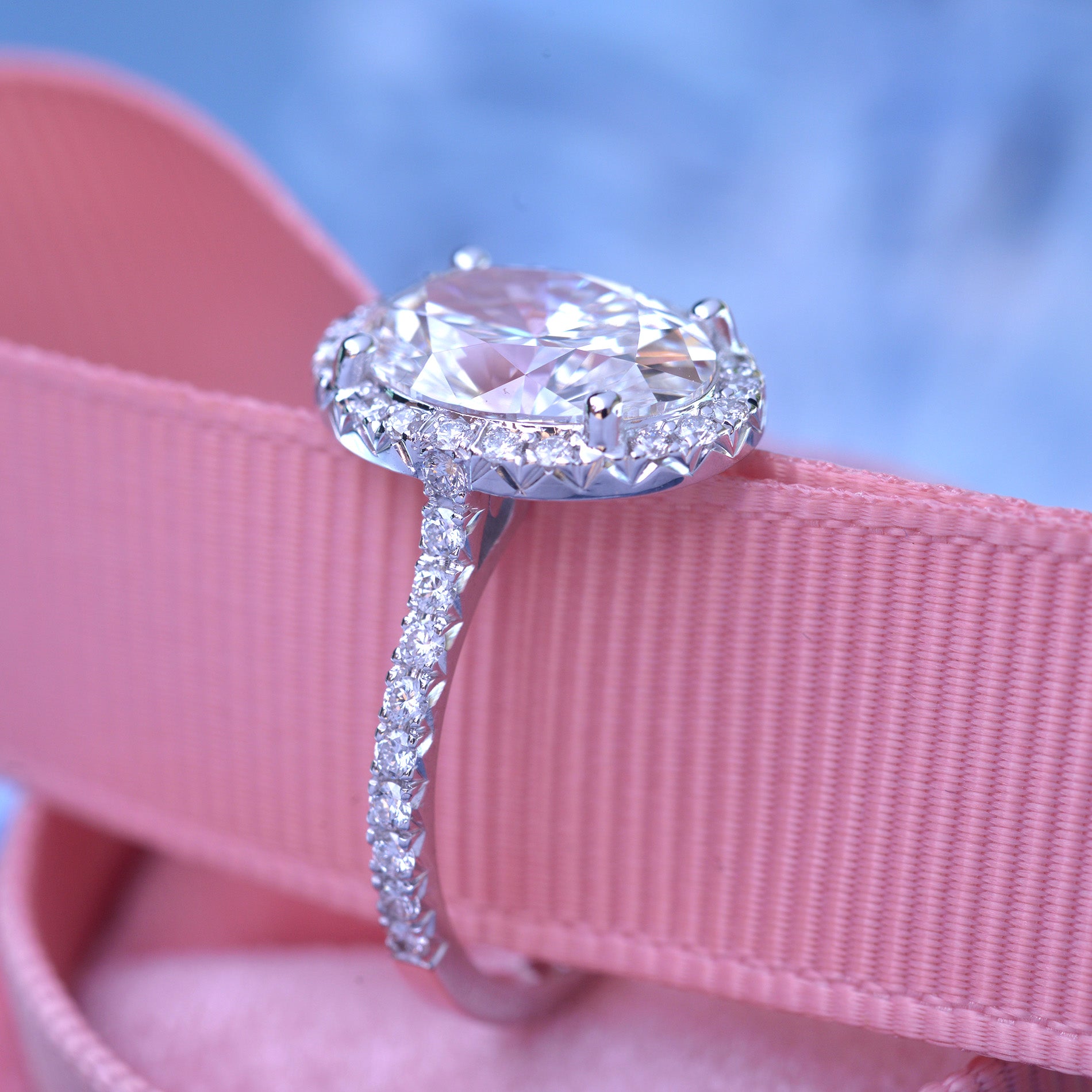 3 carat oval Halo engagement ring french cut pave in white gold with a lab grown diamond side view