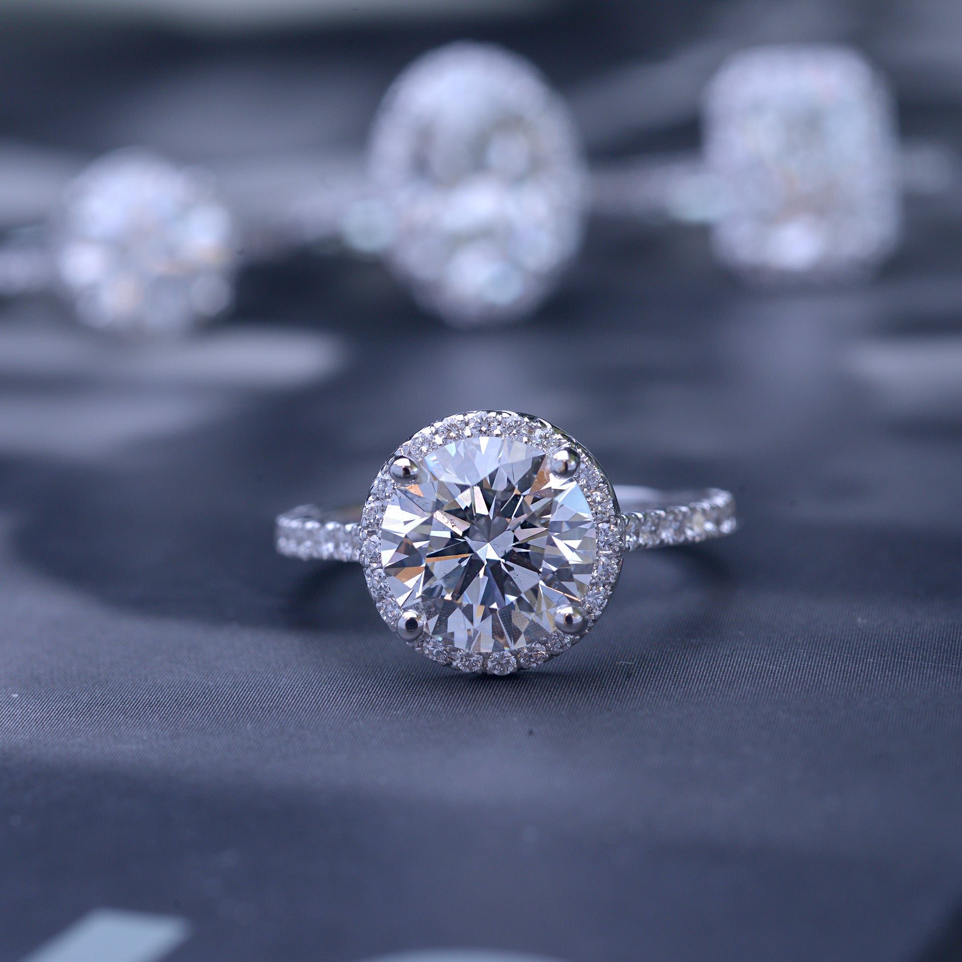 3 carat oval Halo engagement ring french cut pave in white gold