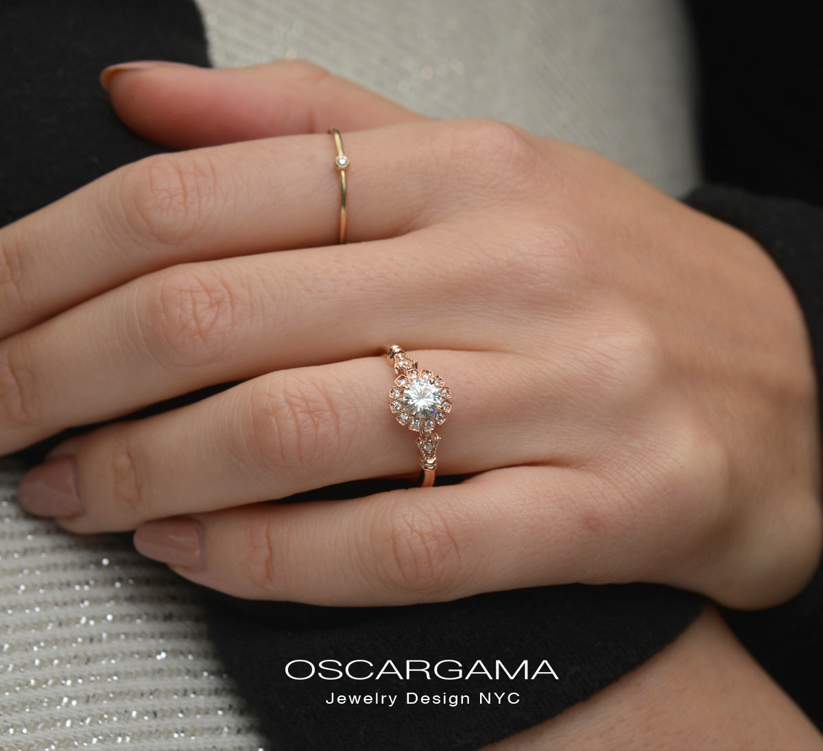 round halo vintage inspired engagement ring in rose gold in a hand