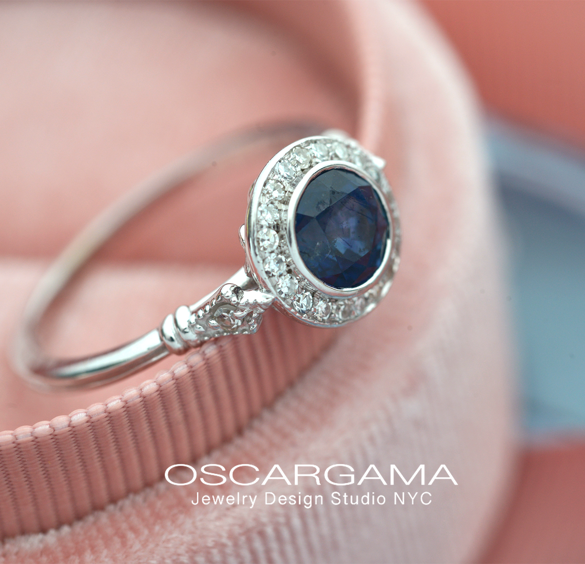 blue sapphire vintage engagement ring in white gold pink background