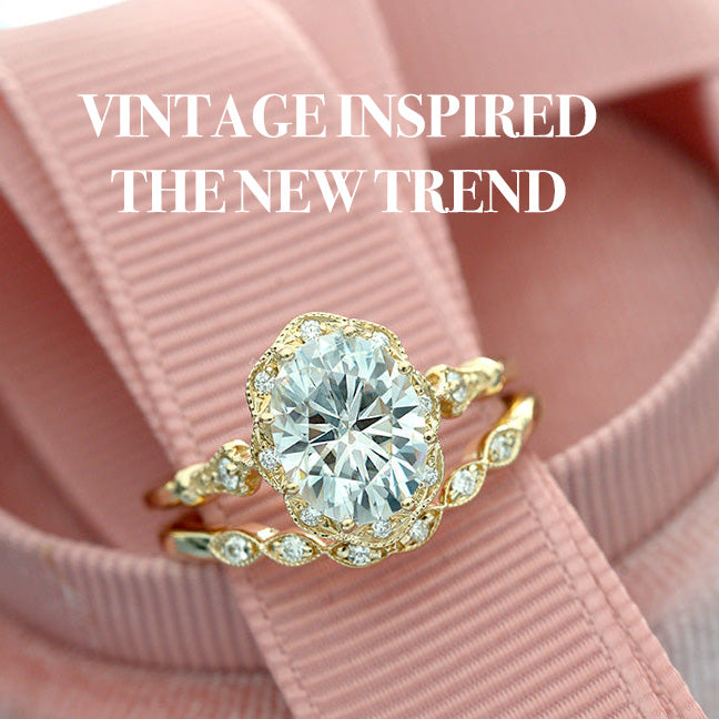 oval halo vintage inspired engagement ring set in yellow gold 