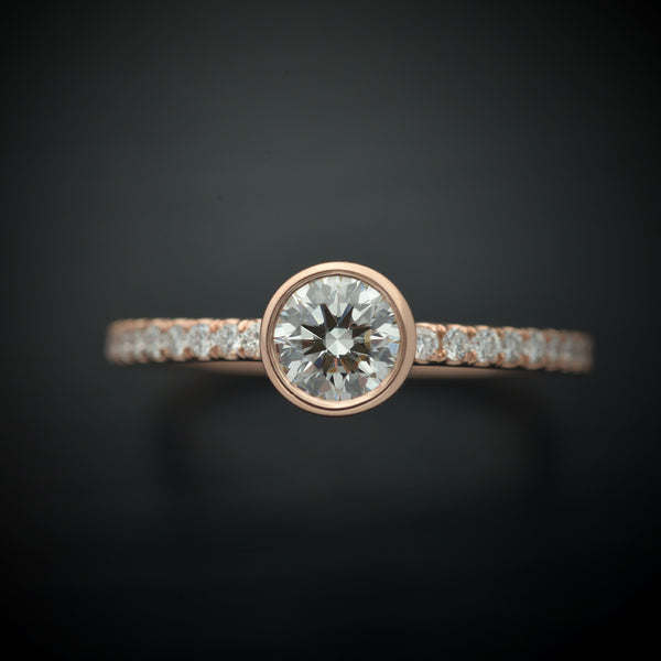 round bezel style engagement ring with pave in rose gold