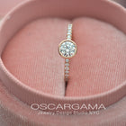 round bezel style engagement ring with pave in rose gold