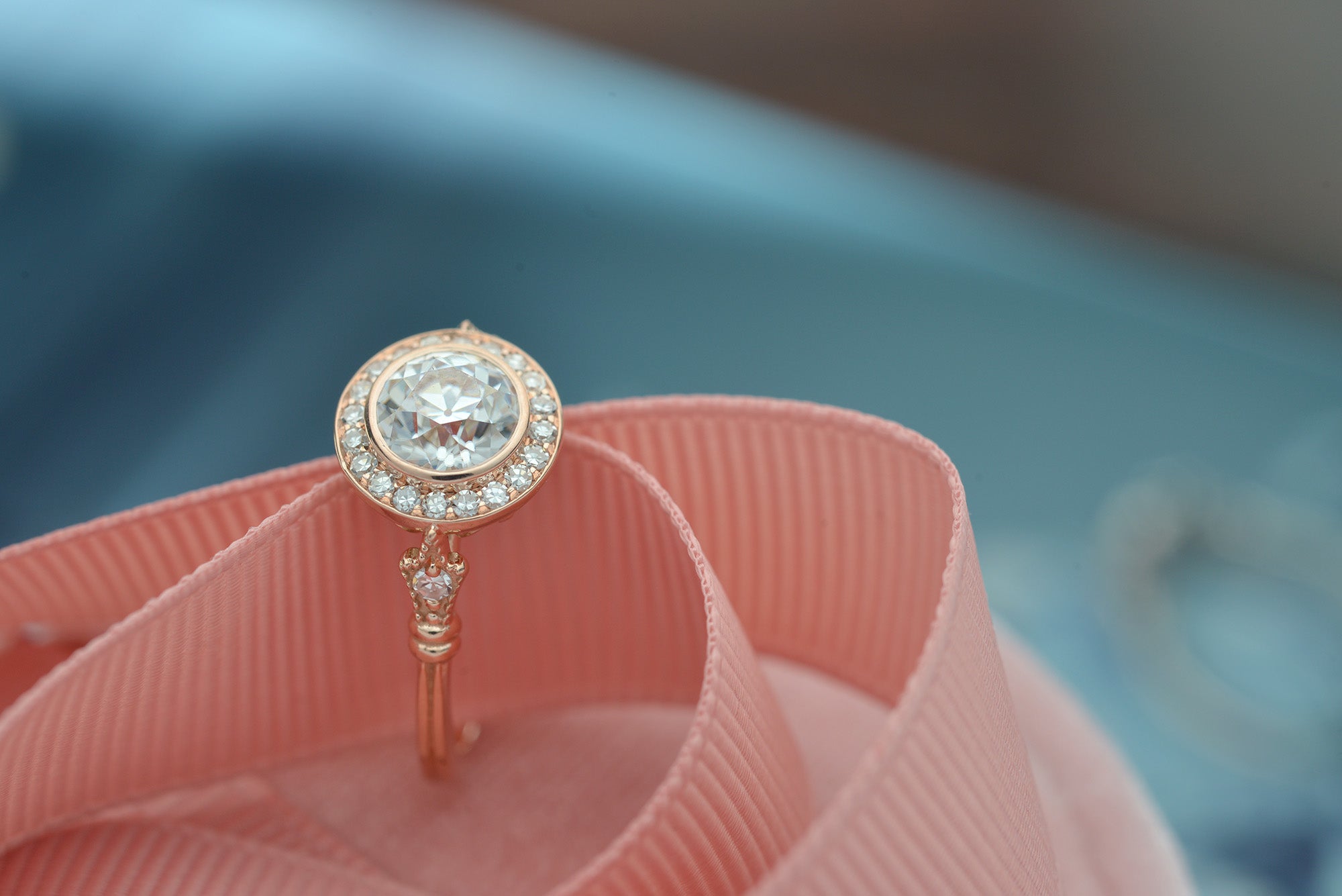 round bezel halo vintage look engagement ring in rose gold