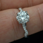 solitaire engagement ring twist band with diamonds in finger