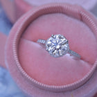 round solitaire engagement ring under halo in white gold with 2 carat lab grown diamond