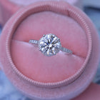 round solitaire engagement ring under halo in white gold with 2 carat lab grown diamond