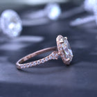 Oval halo 2.5 carat engagement ring with french cut pave in rose gold Vintage inspired side view