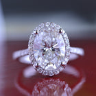 3 carat oval Halo engagement ring french cut pave in white gold with a lab grown diamond front view