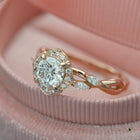 Rose gold engagement ring vintage inspired halo with a vine twist band