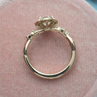 Rose gold engagement ring vintage inspired halo with a vine twist band front view