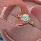 yellow gold engagement ring  round flower halo