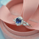 blue sapphire halo engagement ring vine twisted band