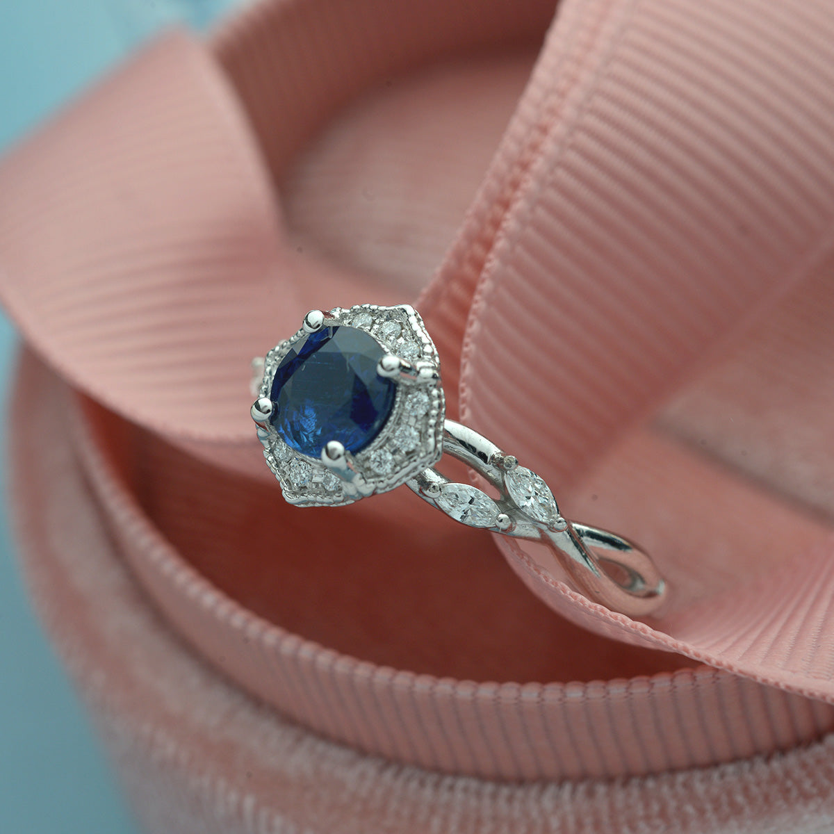 blue sapphire halo engagement ring vine twisted band