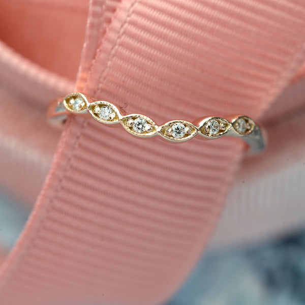 curved scalloped wedding band with 6 diamonds in rose gold