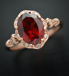 red garnet oval halo rose gold engagement ring 