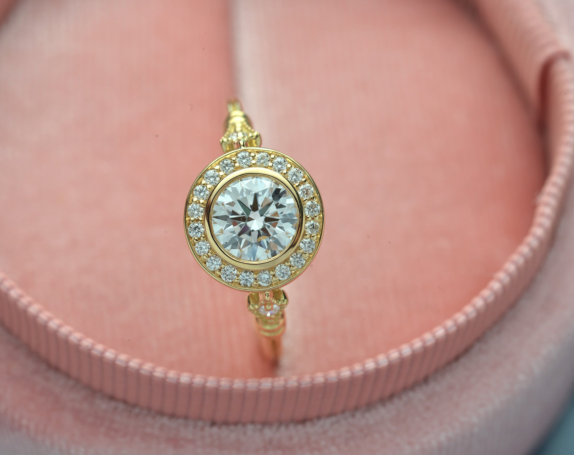 round bezel halo vintage look engagement ring in rose gold