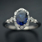 white gold halo oval flower engagement ring vintage style with blue sapphire