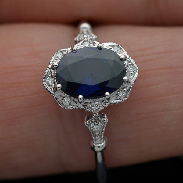 white gold halo oval flower engagement ring vintage style with blue sapphire