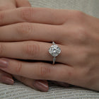 Lyzzy vintage inspired round engagement ring in white gold on a hand