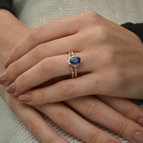 Blue Sapphire Vintage engagement Ring in hand