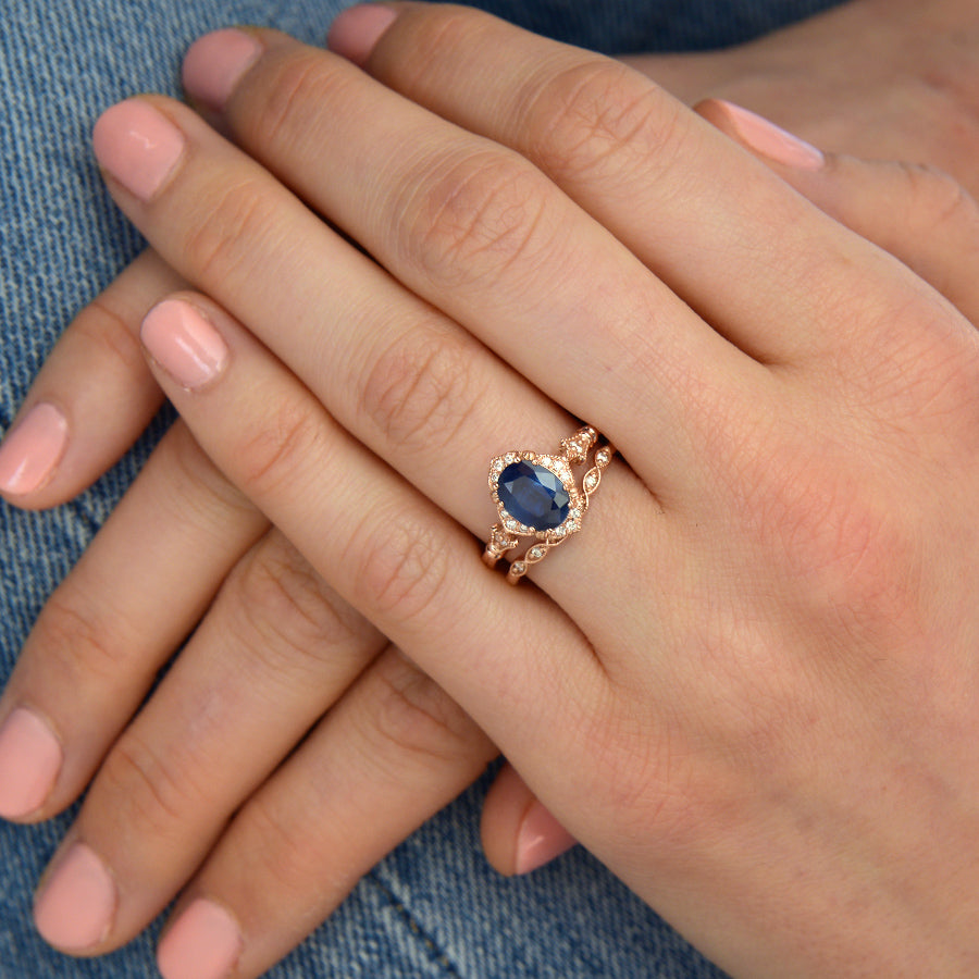 Blue Sapphire Vintage engagement Ring in hand