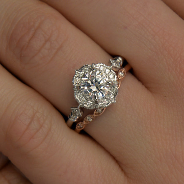 Lyzzy vintage inspired round engagement ring in white gold ona finger