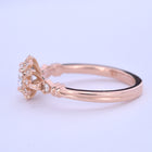 round halo vintage inspired engagement ring in rose gold  side view