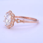 oval halo engagement ring vintage in pink gold