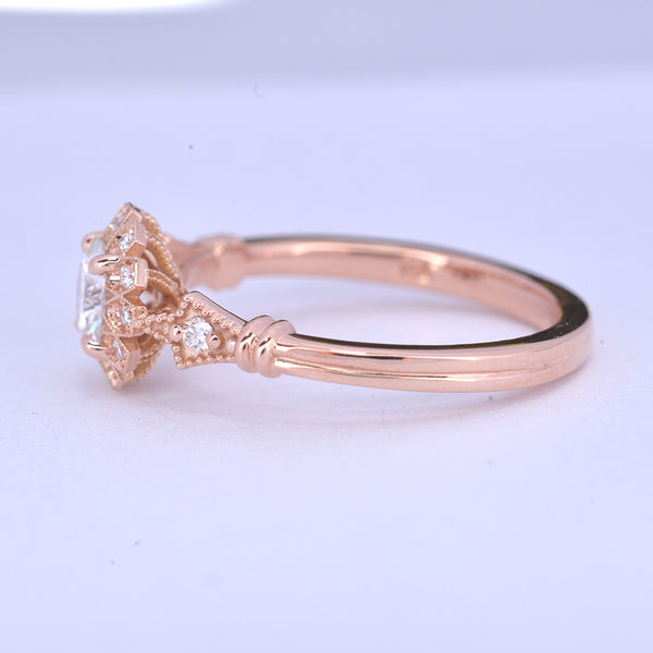 round halo vintage inspired engagement ring in rose gold  side view