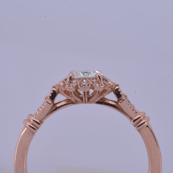 round halo vintage inspired engagement ring in rose gold  front view