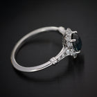 oval blue sapphire engagement ring in white gold vintage look top view