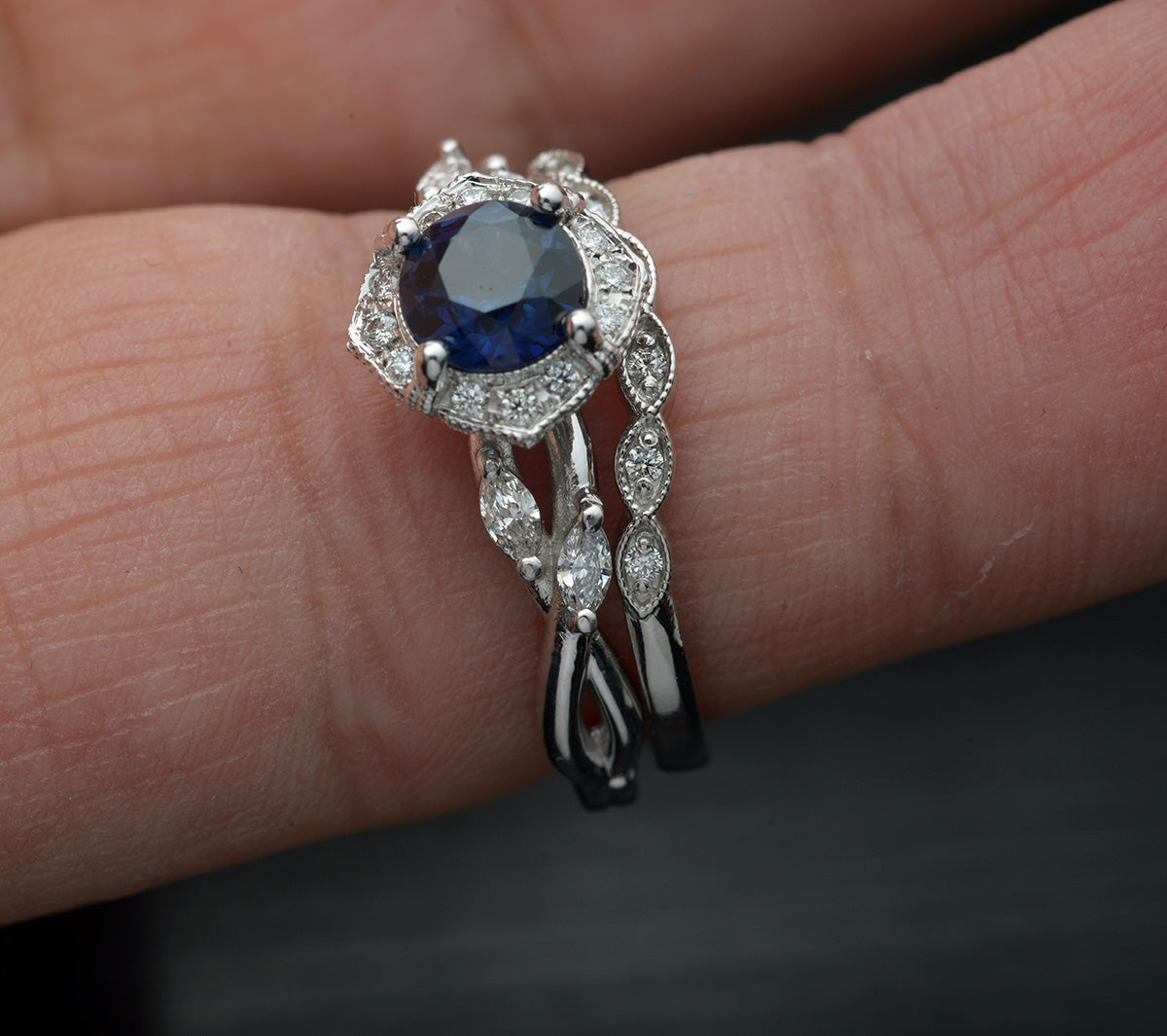 white gold blue sapphire halo engagement ring twisted band