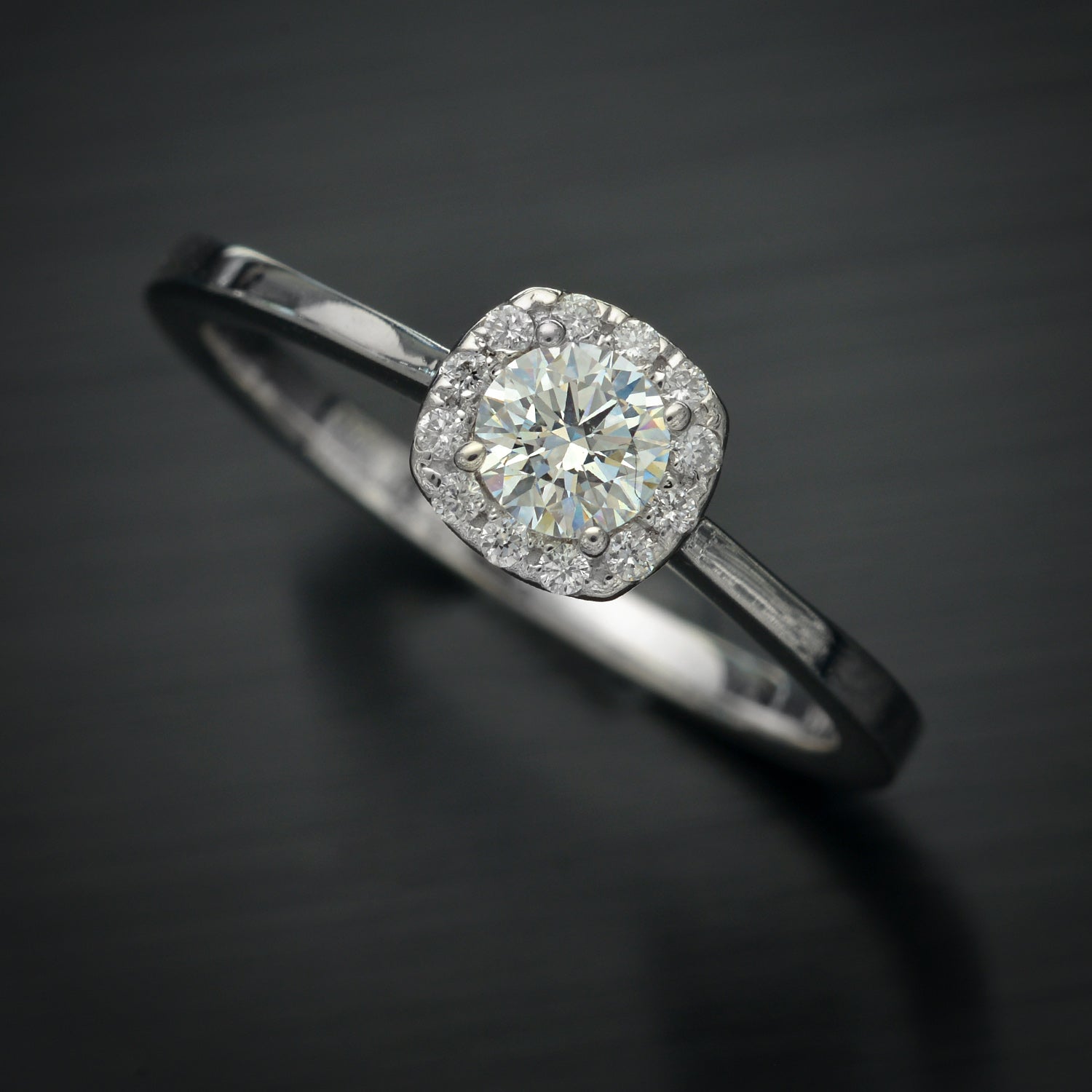 engagement ring with a cushion halo in white gold