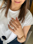 woman showing a Diamond solitaire engagement ring 2ct on her hand