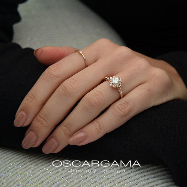 vintage cushion halo engagement ring rose gold in a hand