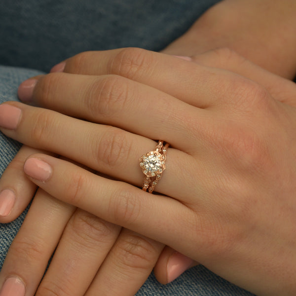 vintage cushion halo engagement ring rose gold in a hand
