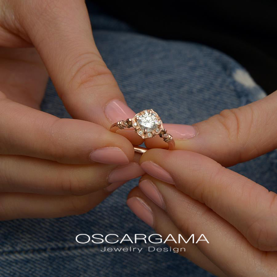 vintage cushion halo engagement ring rose gold in a hand