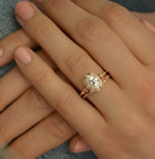 oval halo engagement ring vintage in a hand