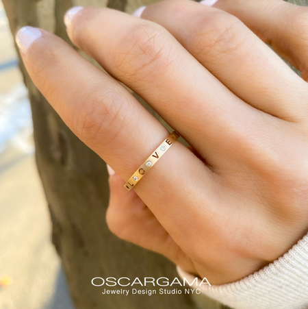 Gold Band LOVE or XOXO in 14k Rose gold satin finish in a hand