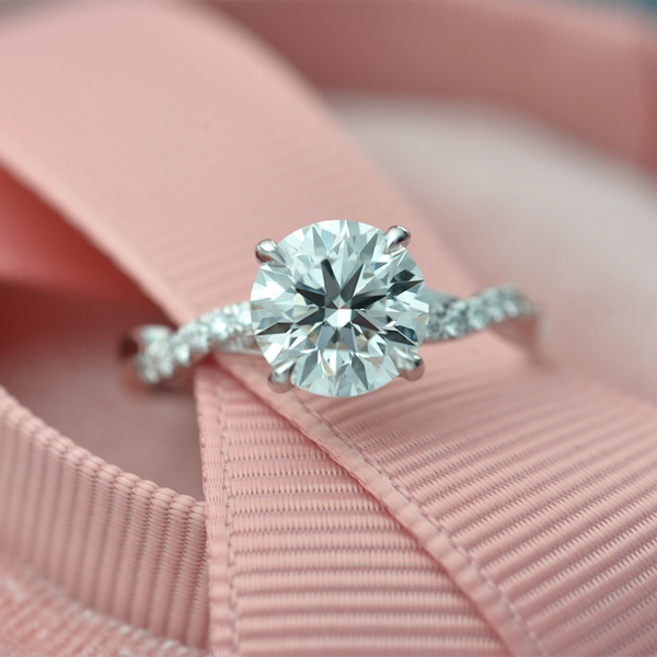 Classic Twist Solitaire diamond engagement ring with micro pave