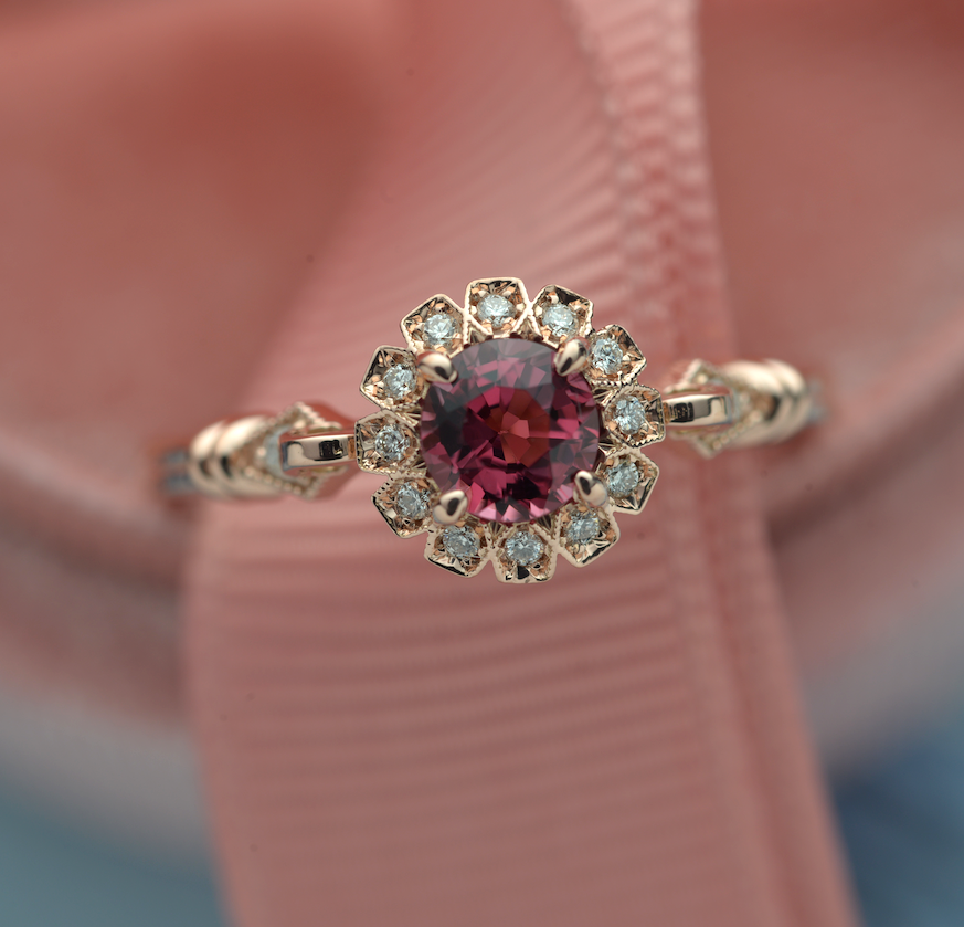 round halo vintage inspired look with a round red garnet center stone