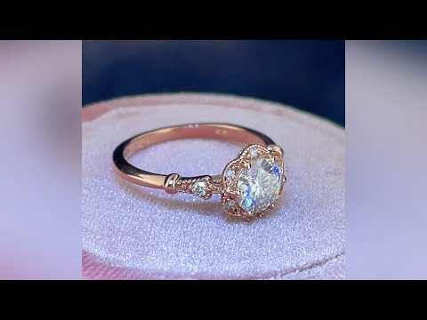 video of vintage style engagement ring in pink gold in a rotating table