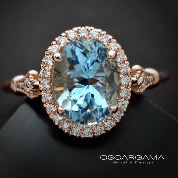 Oval aqua marine engagement ring halo in rose gold vintage inspired