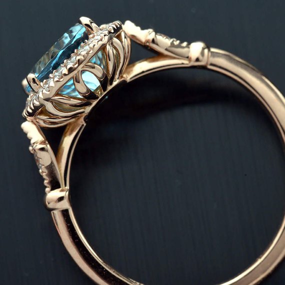 Oval aqua marine engagement ring halo in rose gold vintage inspired