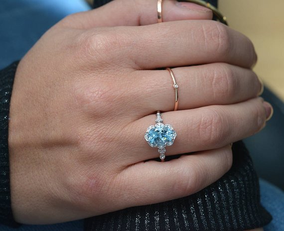 wedding rings aqua blue background