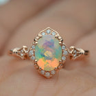 oval opal engagement ring in rose gold