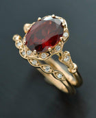 red garnet oval halo rose gold engagement ring set