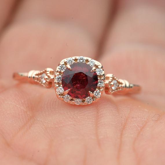 rose gold cushion halo engagement ring red garnet red center