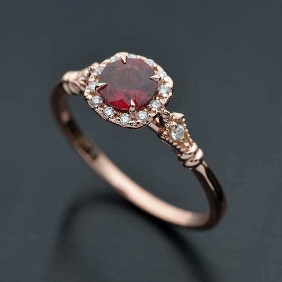 rose gold cushion halo engagement ring red garnet red center